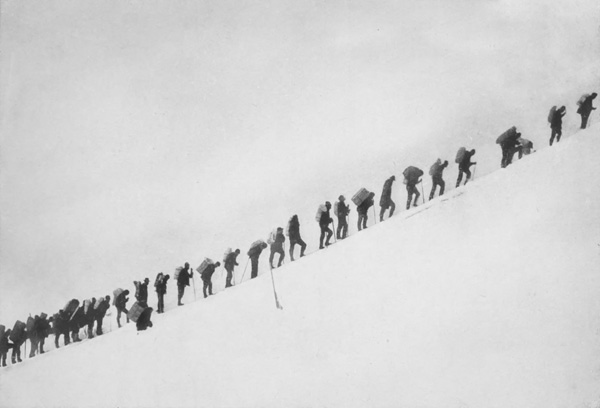 We tightened our girths and our pack-straps: we linked on the Human
Chain, Struggling up to the summit, where every step was a pain.